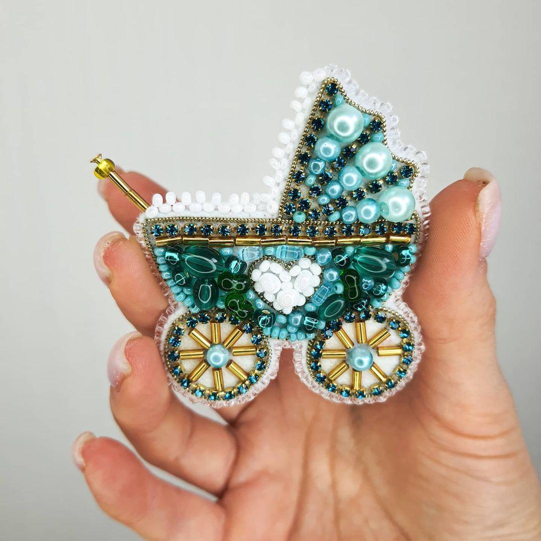 Stroller brooch kit with shimmering crystal beads.